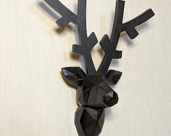 Deer head wall decoration, painted black