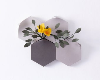 Pre-set hexagonal modular wall-mount vase in cool grey with handmade flowers by Eileen Ng handmade