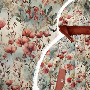 May include: A hooded jacket with a floral print featuring red, pink, and green watercolour flowers on a light blue background.