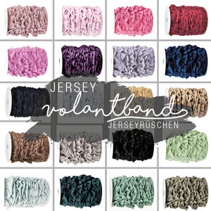 Puede incluir: Una colección de 12 rollos de cinta de volante de jersey en varios colores, incluyendo rosa, morado, azul, marrón, beige, negro y verde. La cinta está hecha de tejido de jersey suave y elástico, perfecto para añadir un toque de elegancia a cualquier proyecto.
