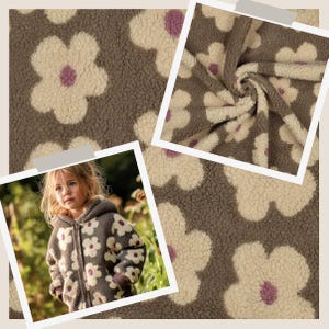 Könnte beinhalten: Eine Kapuzenjacke aus braunem, cremefarbenem und violettem Sherpa-Fleece mit Blumenmuster. Die Jacke verfügt über einen durchgehenden Frontreißverschluss, lange Ärmel mit braunen Bündchen und eine Kapuze. Der Stoff hat eine strukturierte, flauschige Optik.