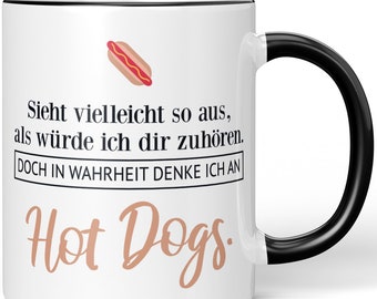 JUNIWORDS Tasse "Sieht vielleicht so aus, als würde ich dir zuhören. Doch in Wahrheit denke ich an Hot Dogs." - 100 % Made in Germany