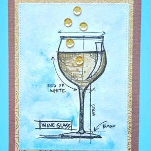 May include: A rectangular greeting card featuring a hand-drawn sketch of a wine glass with gold sequins. The sketch includes labels for WINE GLASS, STEM, BASE, and RED OR WHITE. The card has a light blue watercolor background and a tan border.