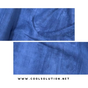 May include: Close-up of a blue suede fabric with a soft, textured surface.