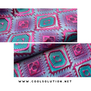 May include: A close-up of a fabric with a geometric pattern. The fabric is a deep purple color with teal and pink accents. The pattern is made up of squares and triangles. The fabric is folded in half, and the fold is visible in the center of the image. The text "www.coolsolution.net" is visible at the bottom of the image.