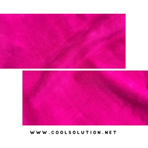 May include: A close-up of a bright pink fabric with a soft, fuzzy texture. The fabric is slightly wrinkled and has a subtle sheen.