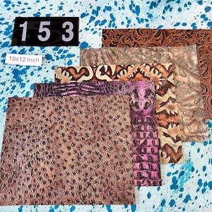 May include: Assortment of leather sheets in various colors and textures. The sheets include embossed floral patterns, crocodile skin, and ostrich skin. The size is 10x12 inches. A black label displays the number "153".