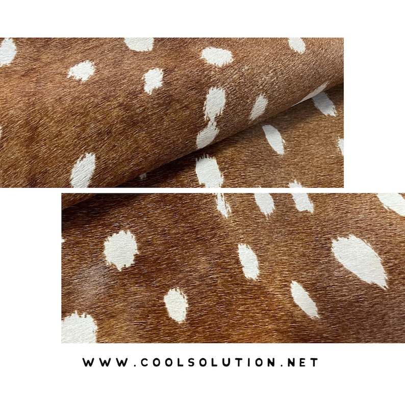May include: Close-up of a brown and white spotted hide. The hide has a natural texture with irregular white spots against a brown background. The image shows the hide folded over, revealing its texture.