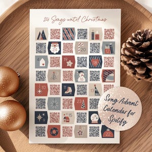 Peut inclure: Un calendrier de l'Avent de Noël avec 24 cases numérotées, chacune avec un code QR. Le calendrier est décoré d'icônes festives et du texte "24 Songs until Christmas". Un autocollant indique "Song Advent Calendar for Spotify".