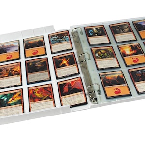 May include: White binder with clear plastic sleeves for holding trading cards. The binder is open and the sleeves are filled with colourful trading cards.