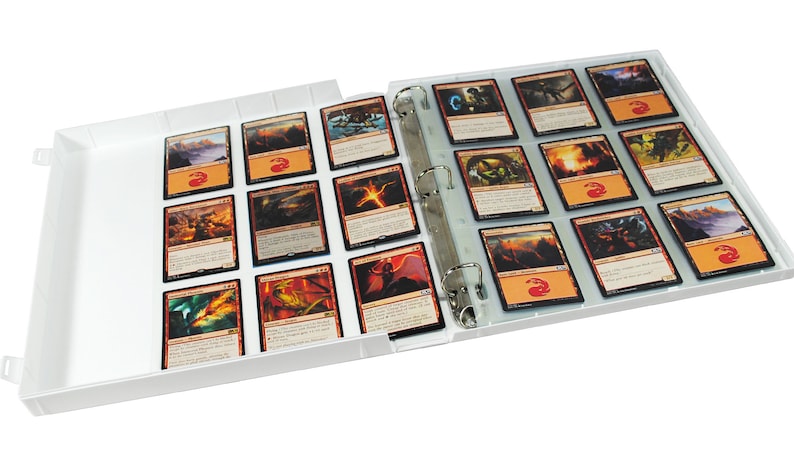 May include: White binder with clear plastic sleeves for holding trading cards. The binder is open and the sleeves are filled with colourful trading cards.