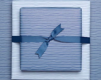 3x double-sided wrapping paper "Water" with light blue and blue lines made of recycled paper - ideal for communion, confirmation and baptism.