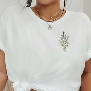 Wildflower shirt embroidered in white with floral embroidery on the chest