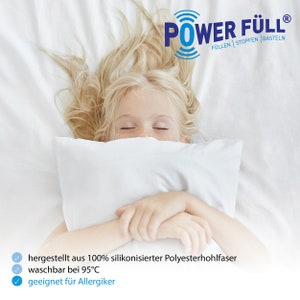 May include: A young girl sleeps soundly on a white pillow with the text "POWER F&Uuml;LL&reg; F&Uuml;LLEN STOPFEN BASTELN" above her. The text below the image reads "hergestellt aus 100% silikonisierter Polyesterhohlfaser waschbar bei 95&deg;C geeignet f&uuml;r Allergiker".