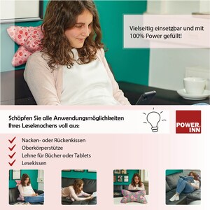 May include: A pink and white patterned pillow with a butterfly design. The pillow is shown being used in various positions, including as a neck pillow, back support, and a reading pillow. The text on the image reads "Vielseitig einsetzbar und mit 100% Power gef&uuml;llt!" and "Sch&ouml;pfen Sie alle Anwendungsm&ouml;glichkeiten Ihres Leseknochens voll aus: Nacken- oder R&uuml;ckenkissen Oberk&ouml;rperst&uuml;tze Lehne f&uuml;r B&uuml;cher oder Tablets Lesekissen".