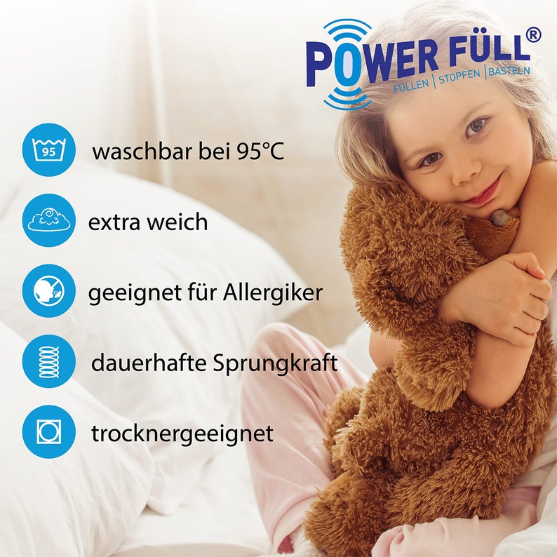 May include: A white, fluffy pillow with a child holding a brown teddy bear. The pillow has a blue label with the text "POWER F&Uuml;LL&reg;" and the words "F&Uuml;LLEN | STOPFEN | BASTELN". The pillow is also labeled with five blue icons indicating that it is washable at 95&deg;C, extra soft, suitable for allergy sufferers, has durable springiness, and is dryer-safe.