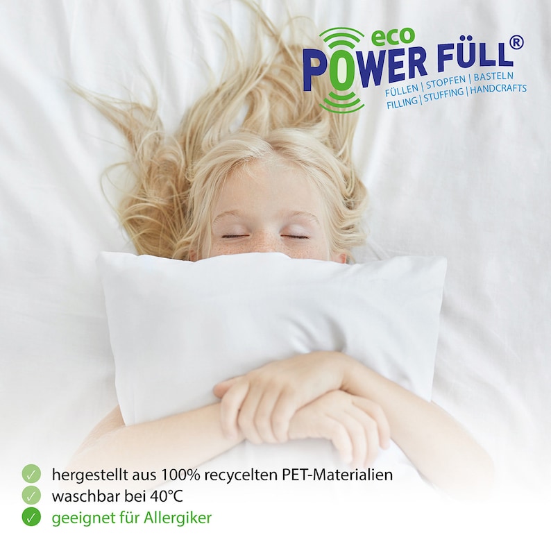 May include: A young girl sleeps soundly on a white bed, her face hidden by a white pillow. The text "eco POWER F&Uuml;LL&reg;" is visible in the upper right corner of the image. The text "F&Uuml;LLEN | STOPFEN | BASTELN FILLING | STUFFING | HANDCRAFTS" is also visible. The text "hergestellt aus 100% recycelten PET-Materialien waschbar bei 40&deg;C geeignet f&uuml;r Allergiker" is visible at the bottom of the image.