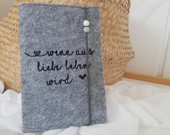 Mother's passport case embroidered "When love becomes life"