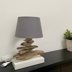 Handcrafted table lamp made of driftwood