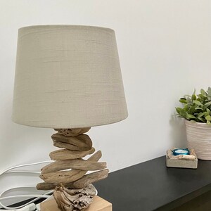Handmade table lamp made of driftwood