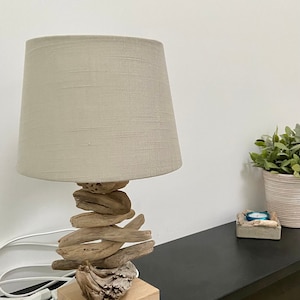 Handmade table lamp made of driftwood