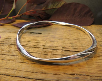 Classic silver twist bangle Supplied nicely wrapped in a gift box with a handwritten care note. Guaranteed all sterling silver.