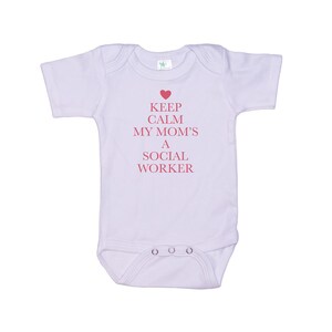 May include: A white baby onesie with a pink heart and the text "Keep Calm My Mom's A Social Worker".