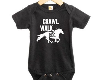 baby clothes with horses on them