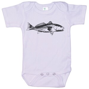 May include: A lavender baby onesie with a black and white illustration of a redfish.
