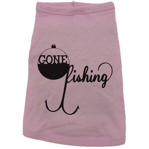May include: Pink dog shirt with a black graphic of a fishing bobber with the text "Gone Fishing" and a hook.