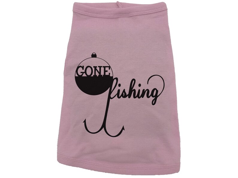 May include: Pink dog shirt with a black graphic of a fishing bobber with the text "Gone Fishing" and a hook.