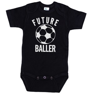 May include: Black baby onesie with white text that says "FUTURE BALLER" and a white soccer ball graphic.