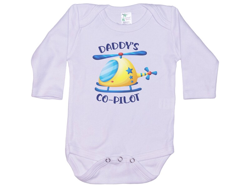 May include: White long-sleeve baby onesie with a blue and yellow helicopter graphic and the text "Daddy's Co-Pilot".