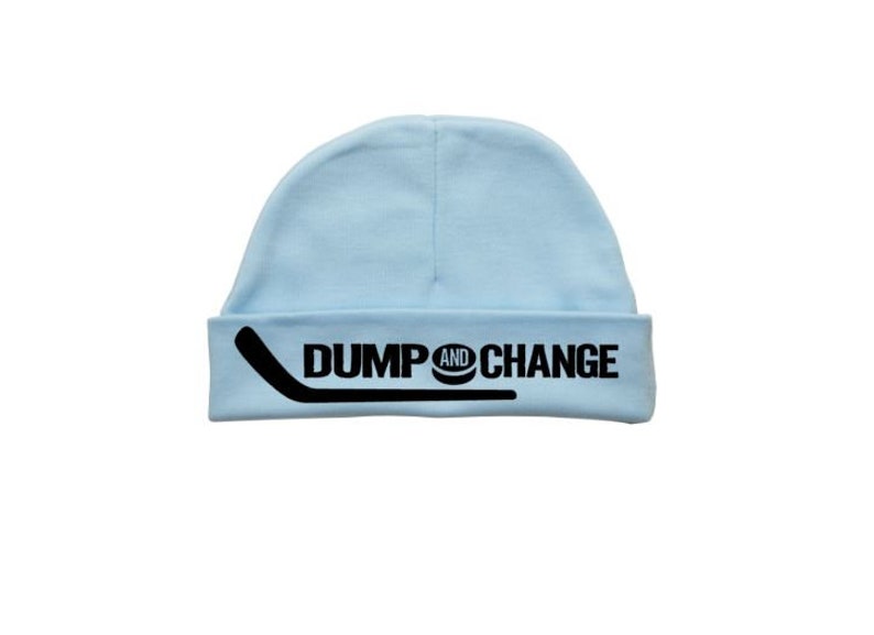 May include: Light blue baby beanie with black text that reads "DUMP AND CHANGE" with a hockey stick and puck graphic.