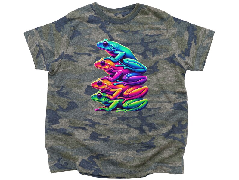 May include: A camouflage t-shirt with a graphic of four stacked frogs in rainbow colors. The frogs are facing to the right and are stacked on top of each other.