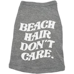 May include: Grey dog t-shirt with white text that reads "Beach Hair Don't Care."