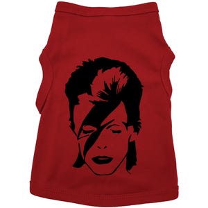 May include: Red dog t-shirt with a black and white silhouette of David Bowie's face.