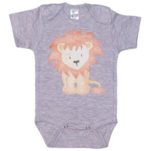 May include: A gray short-sleeved baby onesie with a watercolor illustration of a lion in orange and red.