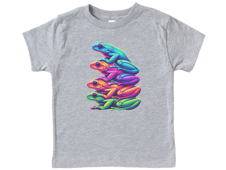 May include: A gray t-shirt with a graphic of four stacked frogs in rainbow colors. The frogs are green, blue, pink, and orange.