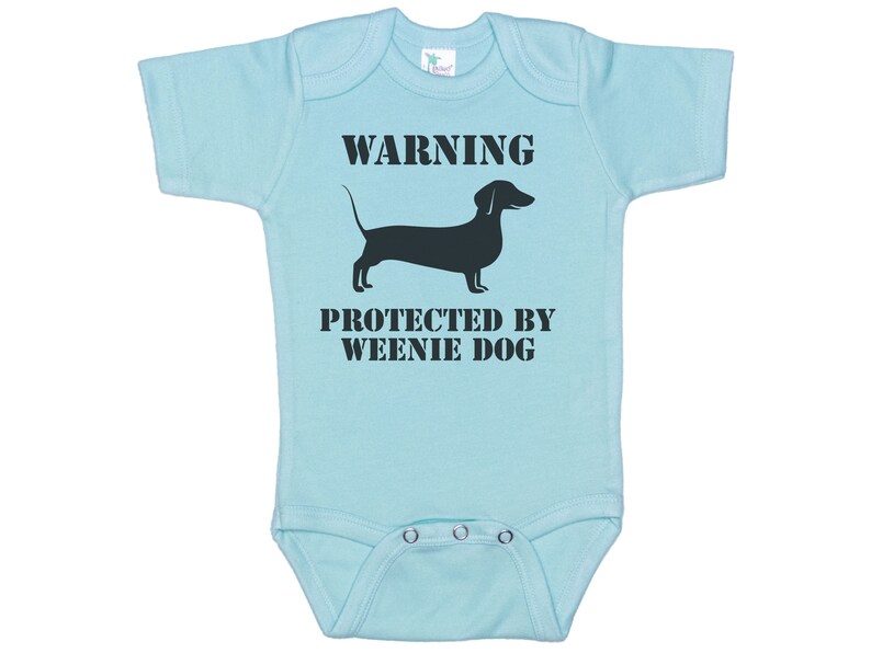 May include: Light blue baby onesie with a black dachshund silhouette and the text "WARNING PROTECTED BY WEENIE DOG".