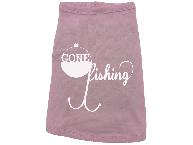 May include: Pink dog shirt with a white graphic of a fishing bobber with the word "GONE" inside and the word "fishing" written in a cursive font below the bobber.