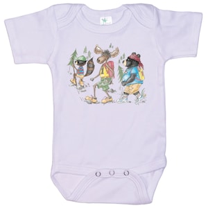 May include: A lavender baby onesie with a cartoon illustration of a moose, raccoon, and bear wearing backpacks and hiking in the woods.