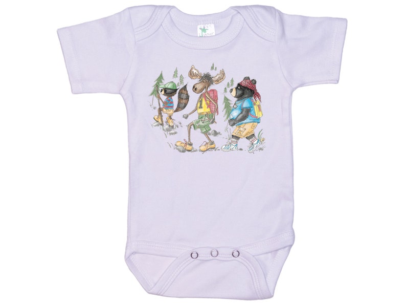 May include: A lavender baby onesie with a cartoon illustration of a moose, raccoon, and bear wearing backpacks and hiking in the woods.
