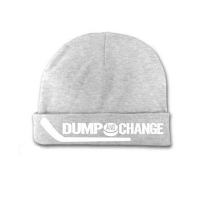 May include: Gray beanie with a white hockey stick and puck graphic and the text "DUMP AND CHANGE".