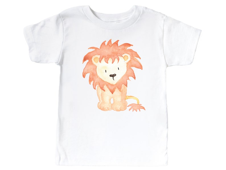 May include: White t-shirt with a watercolor illustration of a cute orange lion with a red mane.