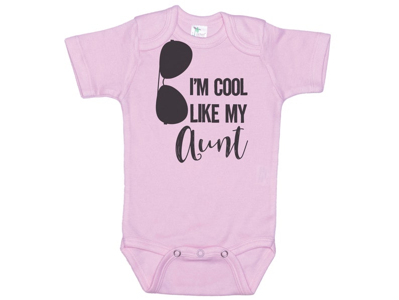 May include: Pink baby onesie with a black graphic of sunglasses and the text "I'm cool like my aunt".