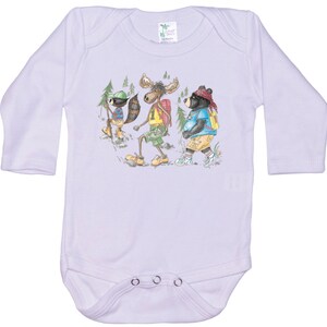 May include: A white long-sleeved baby onesie with a graphic of a moose, a raccoon, and a bear wearing backpacks and hiking in the woods.