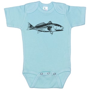 May include: A light blue baby onesie with a black silhouette of a redfish printed on the front.