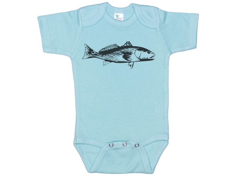 May include: A light blue baby onesie with a black silhouette of a redfish printed on the front.