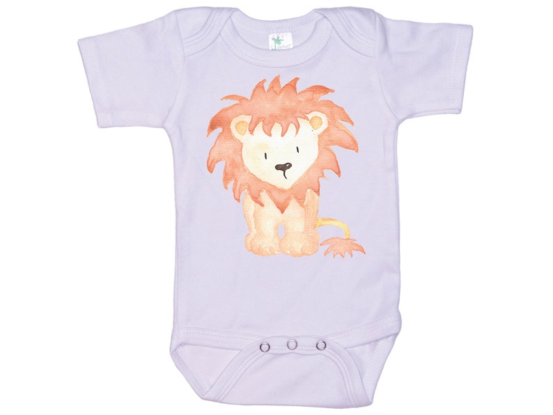 May include: A lavender baby onesie with a watercolor illustration of a lion with a red mane and a yellow body.
